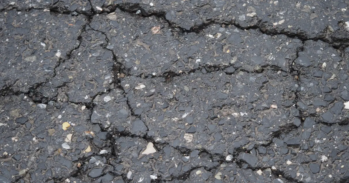Asphalt Crack Sealing or Sealcoating: Which Does Your Parking Lot Need First?