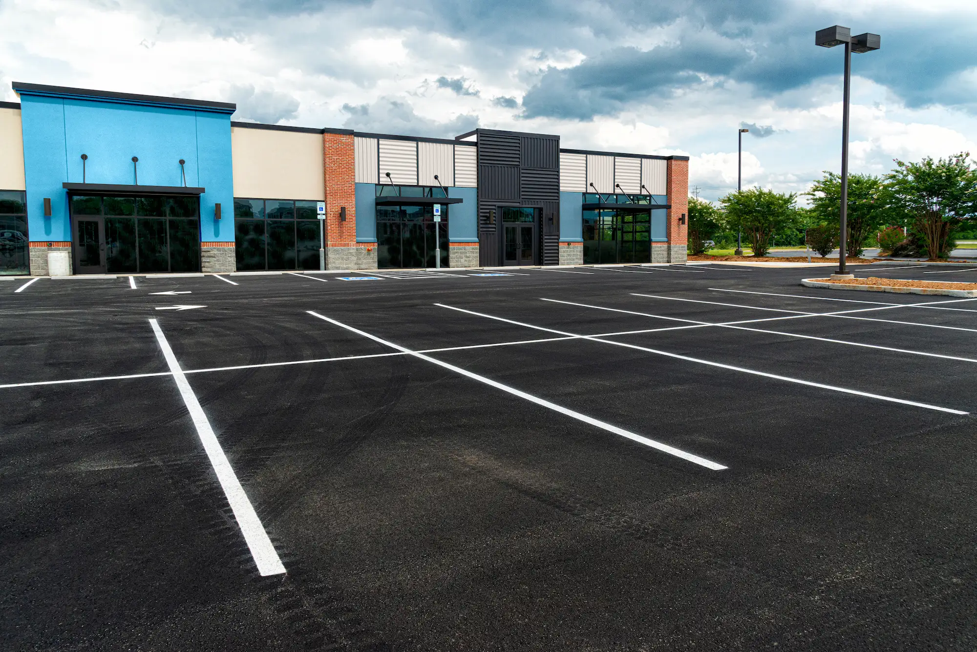Commercial Parking Lot Sealcoating: How to Build a Maintenance Schedule That Actually Protects Your Investment
