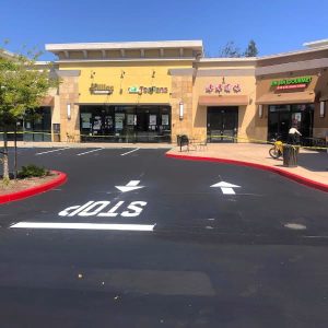 New asphalt parking lot in strip mall