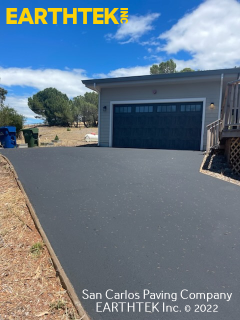 Driveway in San Carlos that has recently been paved with asphalt.