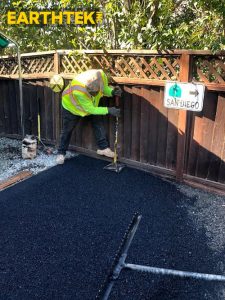 Crew installing paving on a driveway