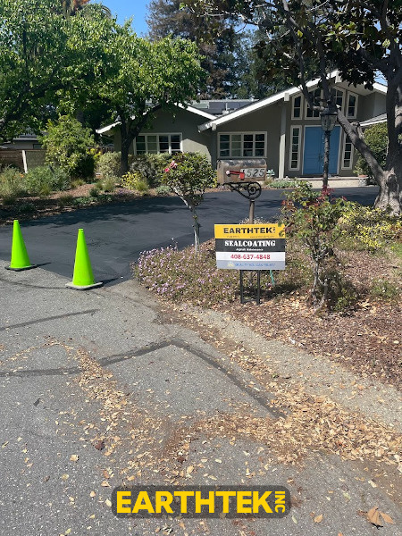driveway with cones while sealcoating dries