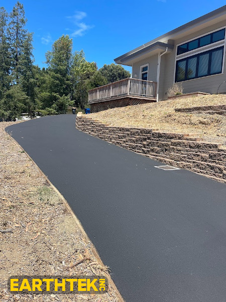 Asphalt driveway with new sealing