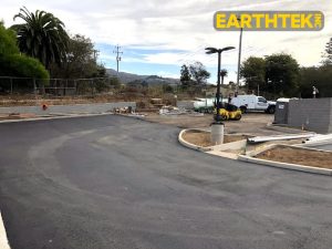 parking lot being paved by a crew