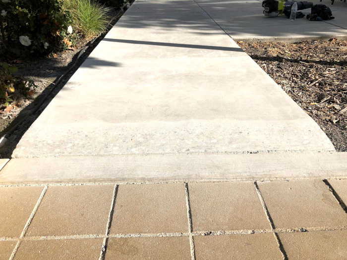sidewalk that has been ground to remove trip hazard