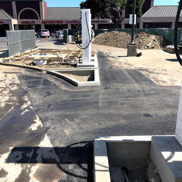 EV charging station with new concrete curbs